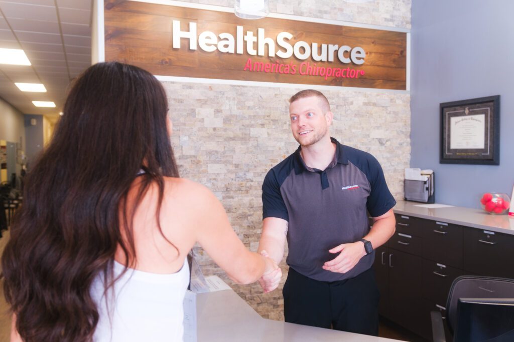 welcoming patient at front desk healthsource story